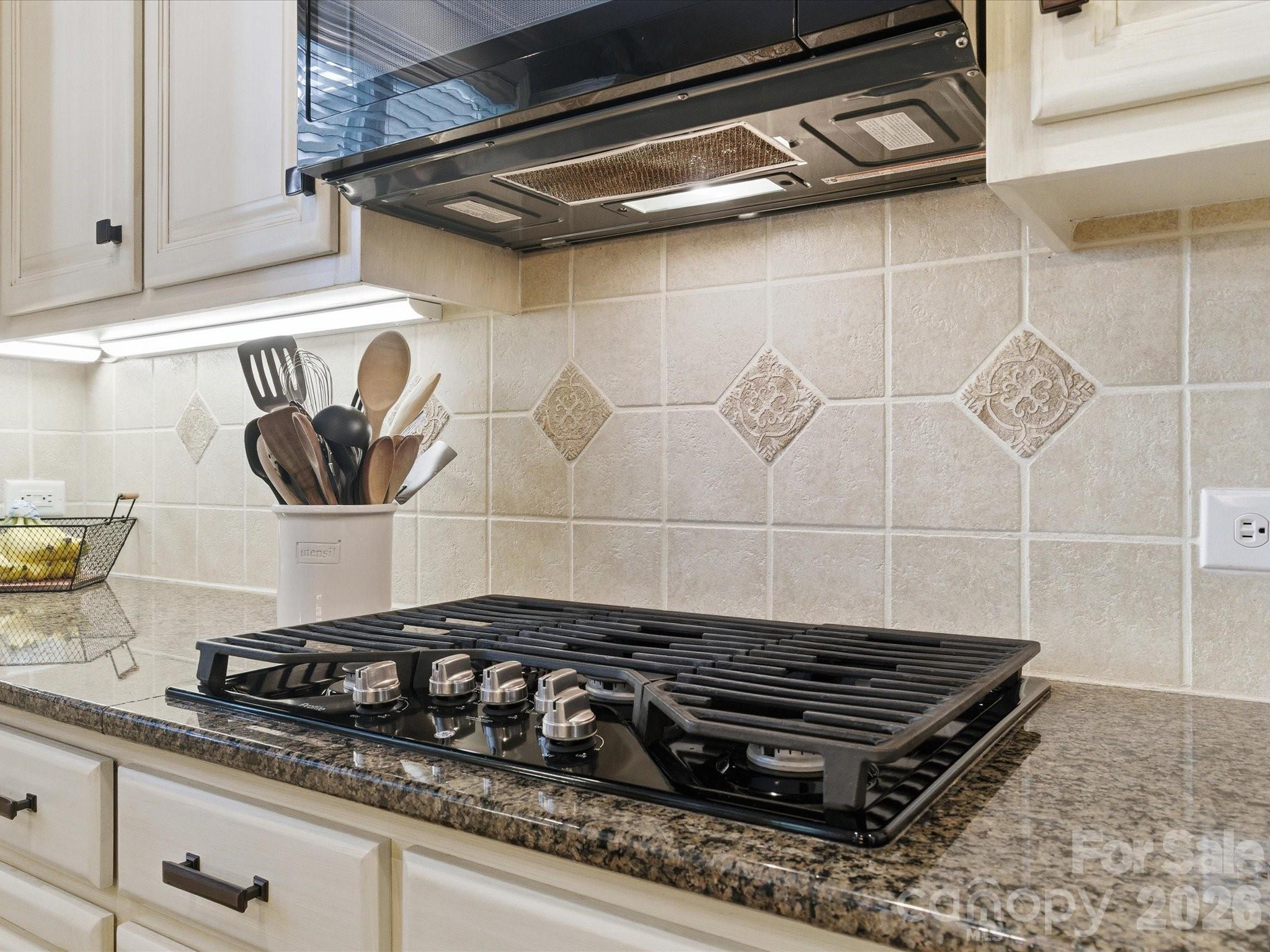 6318 Riverside Oaks Drive Huntersville, NC 28078 - Photo 18 of 48 a stove top oven sitting inside of a kitchen