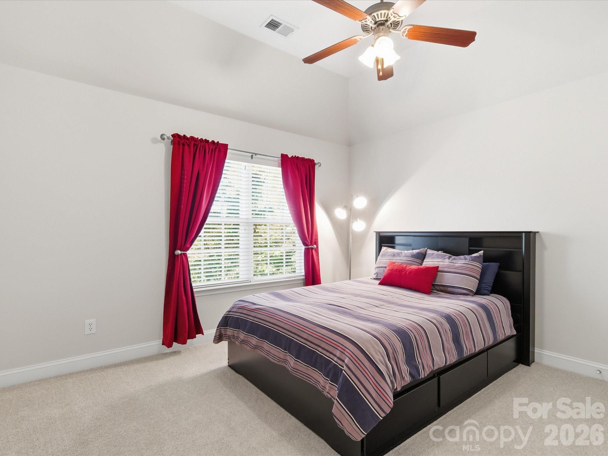6318 Riverside Oaks Drive Huntersville, NC 28078 - Photo 28 of 48 a bedroom with bed and window