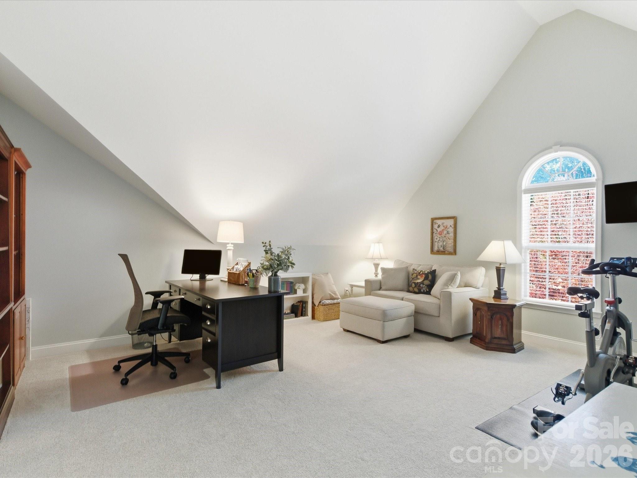 6318 Riverside Oaks Drive Huntersville, NC 28078 - Photo 32 of 48 a living room with furniture and a chandelier