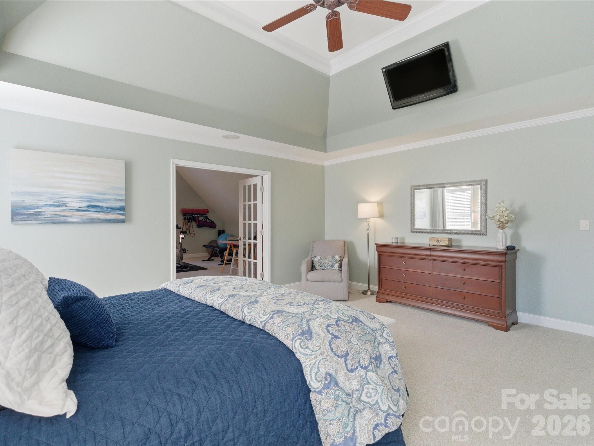 6318 Riverside Oaks Drive Huntersville, NC 28078 - Photo 34 of 48 a bedroom with a bed and a television