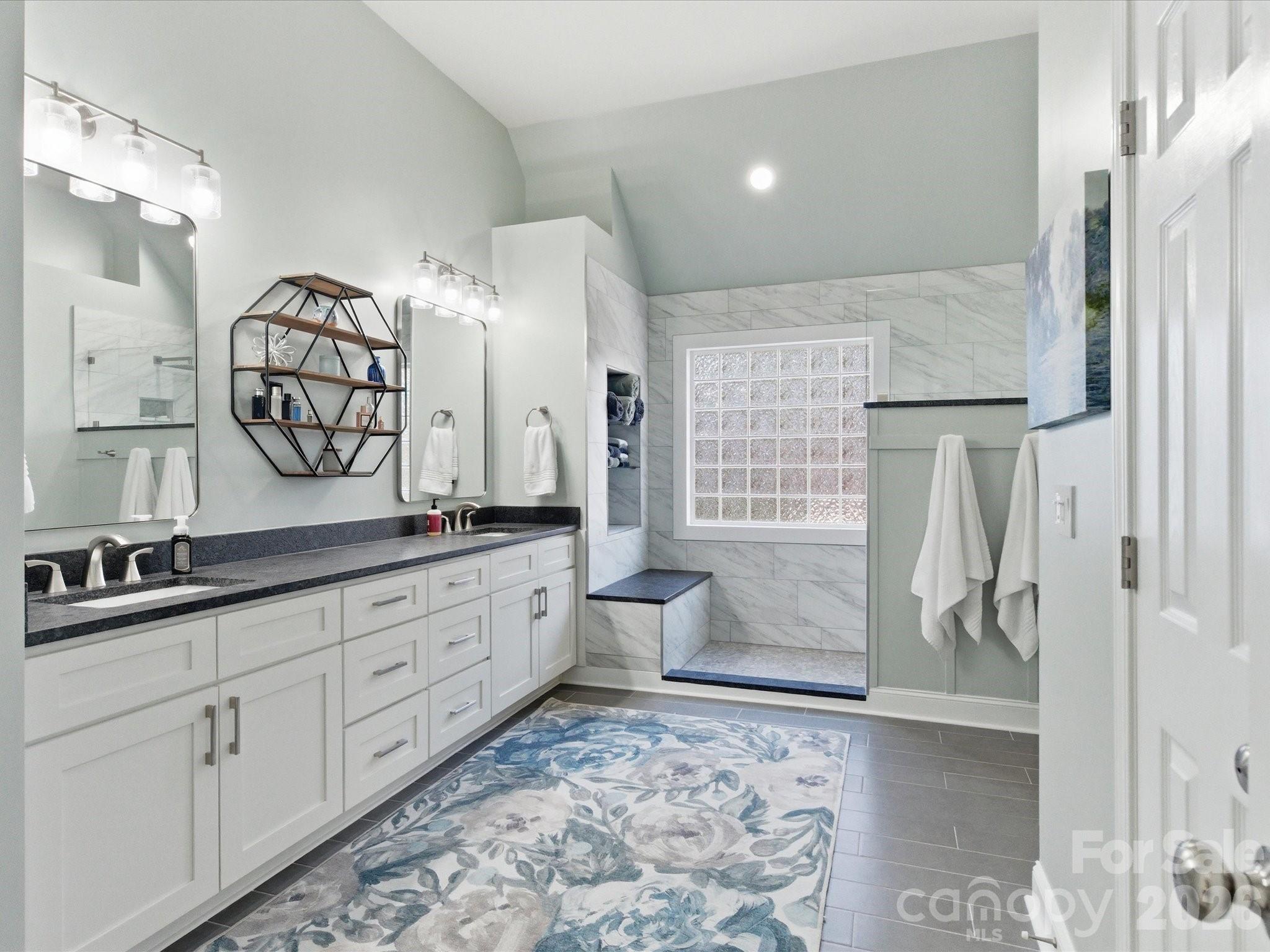 6318 Riverside Oaks Drive Huntersville, NC 28078 - Photo 35 of 48 a spacious bathroom with double vanity and a mirror