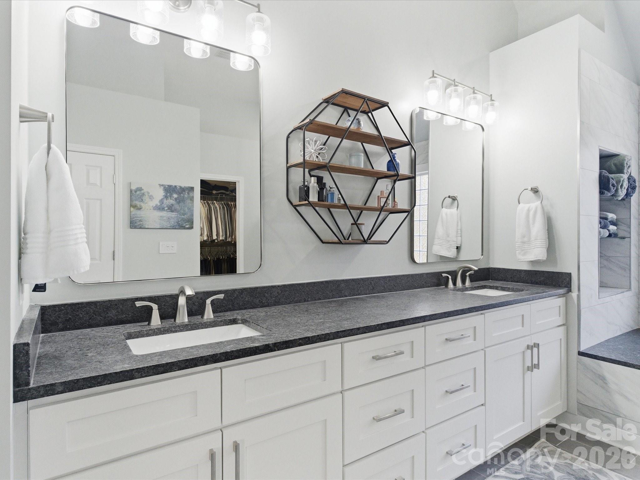 6318 Riverside Oaks Drive Huntersville, NC 28078 - Photo 36 of 48 a bathroom with a granite countertop double vanity sink and a mirror