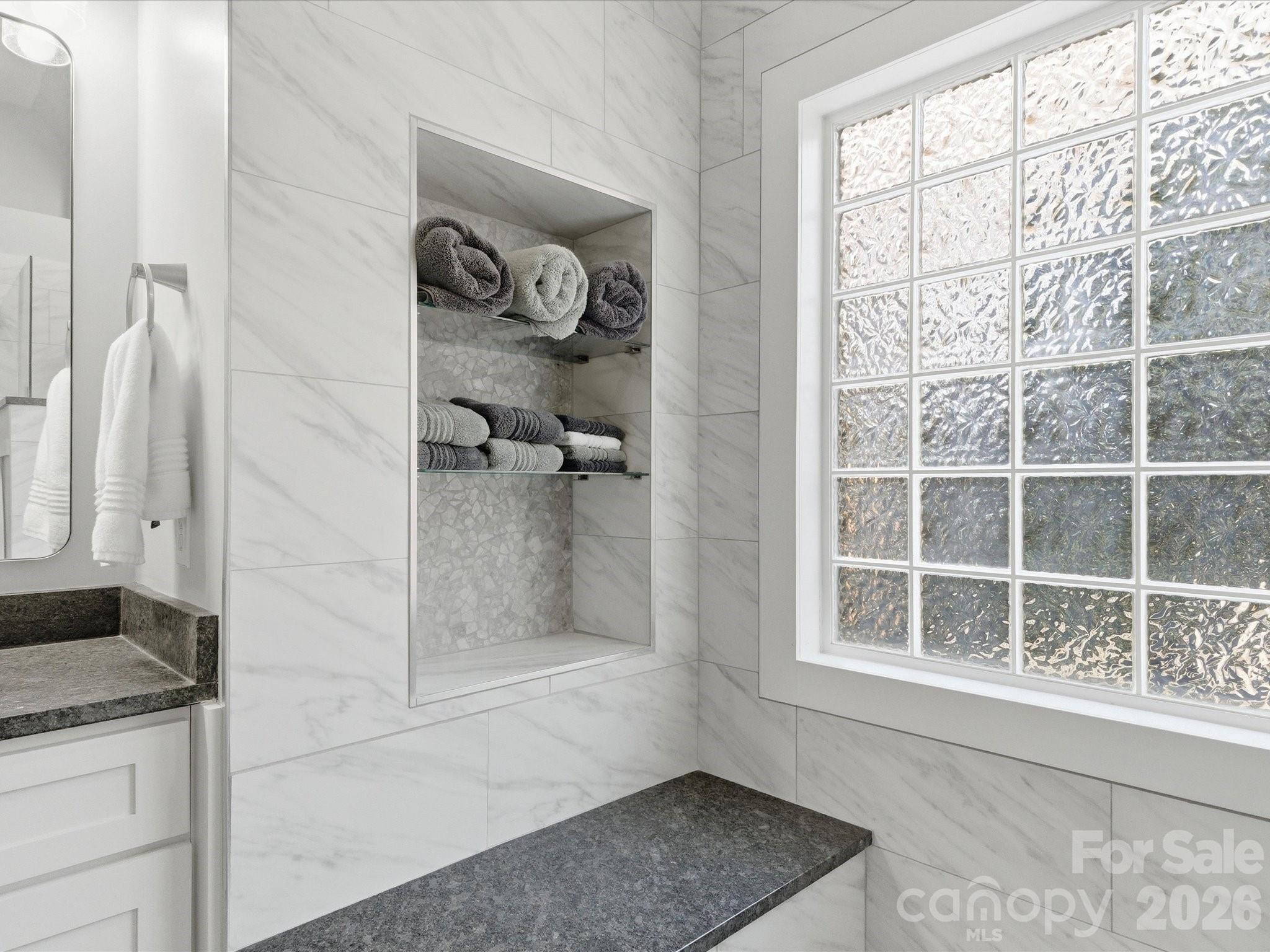 6318 Riverside Oaks Drive Huntersville, NC 28078 - Photo 37 of 48 a bathroom with a granite countertop sink and a shower