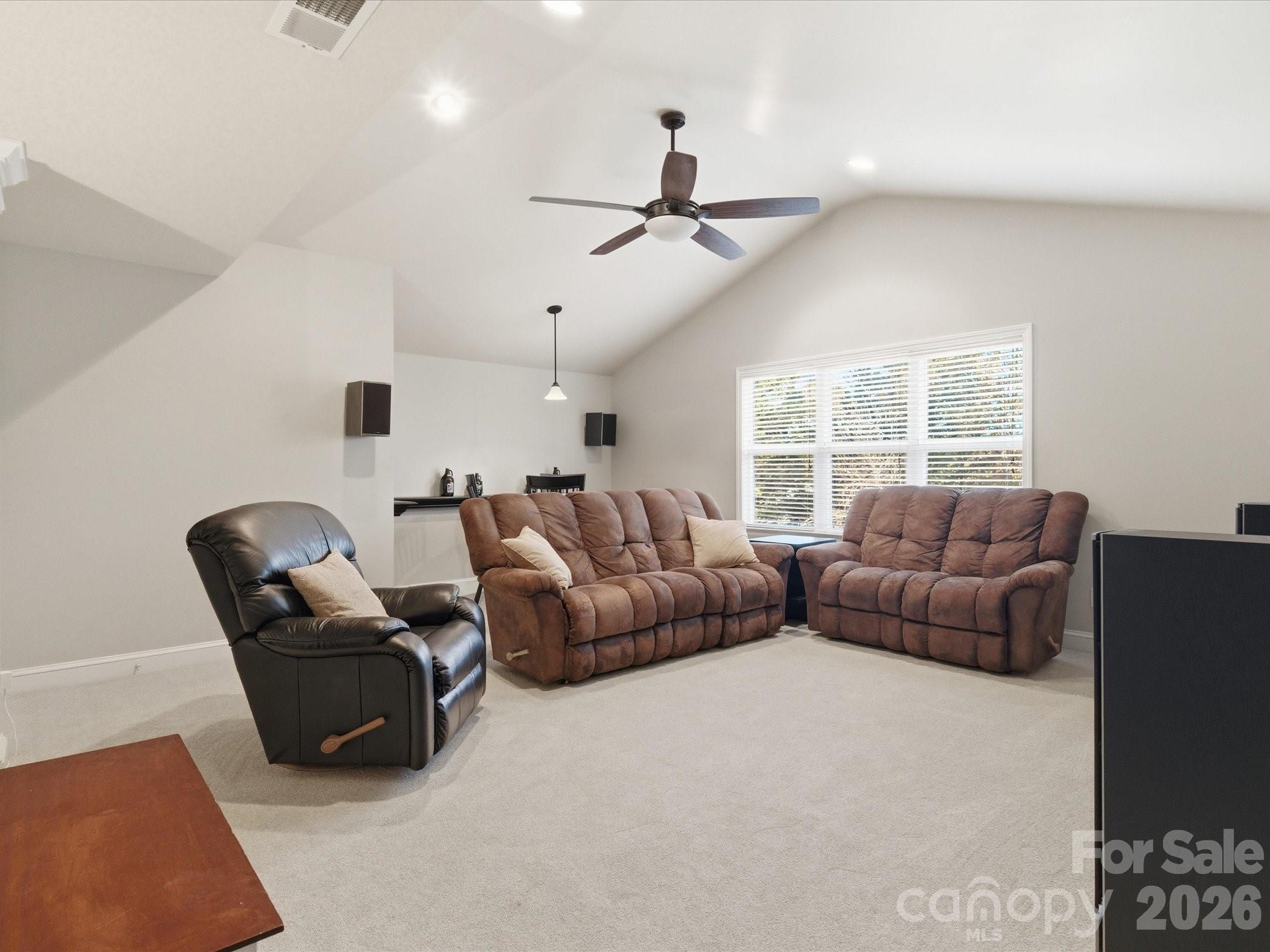 6318 Riverside Oaks Drive Huntersville, NC 28078 - Photo 40 of 48 a living room with furniture and a window