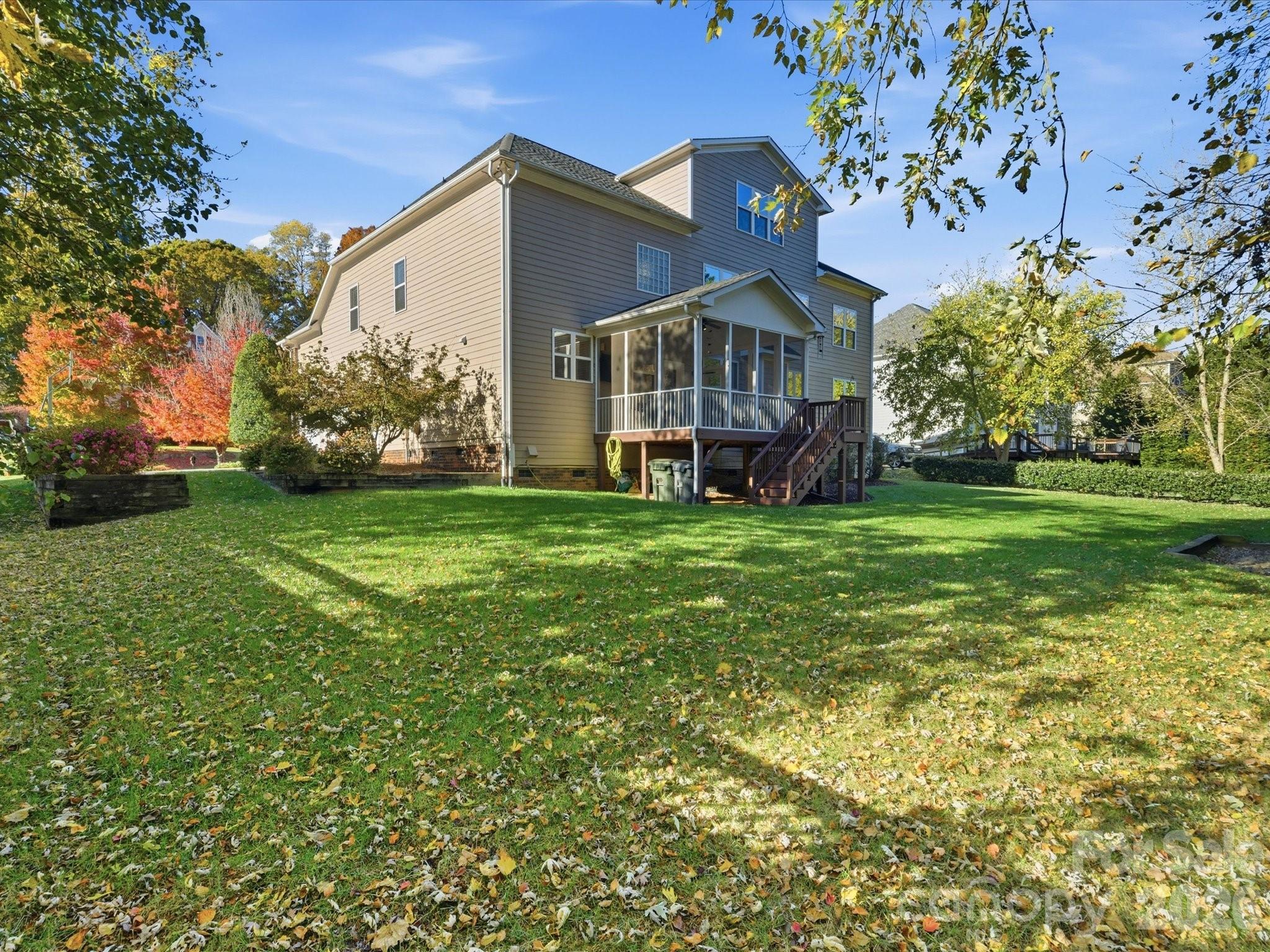 6318 Riverside Oaks Drive Huntersville, NC 28078 - Photo 45 of 48 a view of a house with a big yard and garden