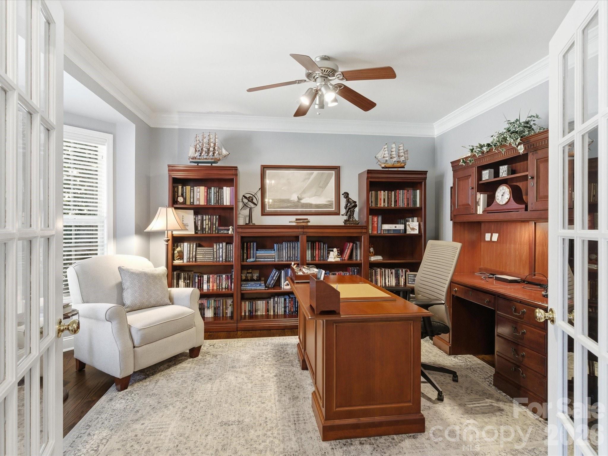 6318 Riverside Oaks Drive Huntersville, NC 28078 - Photo 5 of 48 a view of a livingroom with workspace and a couch