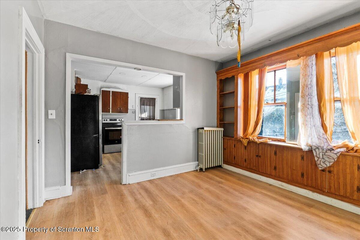 705 Landis Street Scranton, PA 18504 - Photo 12 of 35 a view of a room with a window and wooden floor