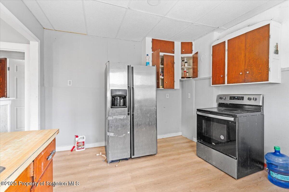 705 Landis Street Scranton, PA 18504 - Photo 14 of 35 a kitchen with stainless steel appliances granite countertop a refrigerator and a stove