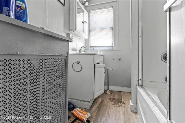 a picture of a bench in front of a building