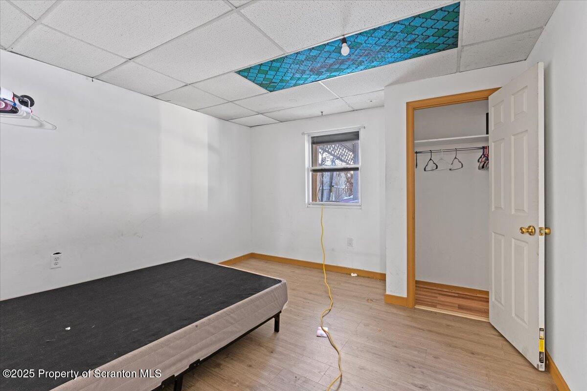 705 Landis Street Scranton, PA 18504 - Photo 24 of 35 a bedroom with a bed and a painting on the wall