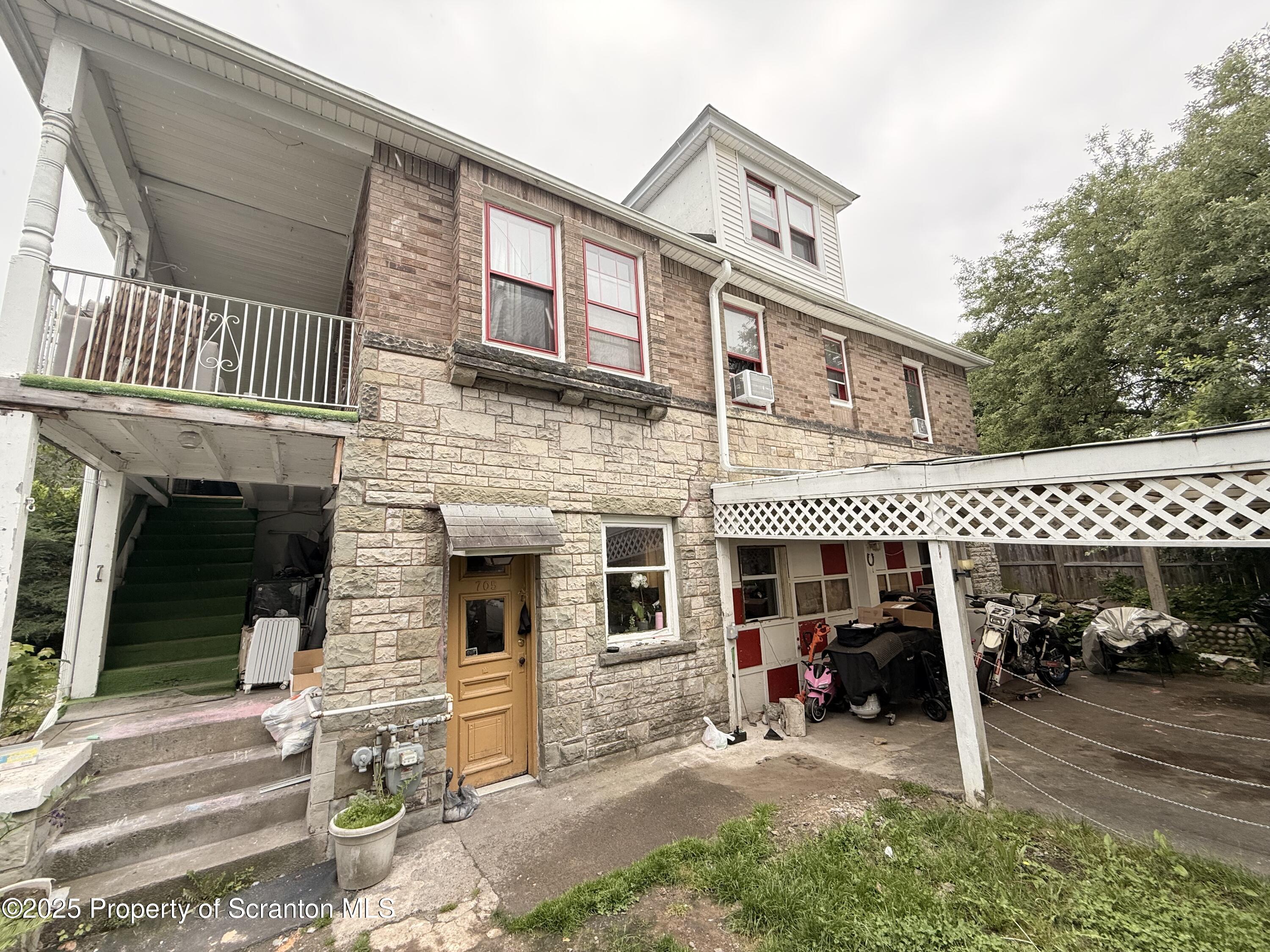 705 Landis Street Scranton, PA 18504 - Photo 3 of 35 a view of a house with a large space and large trees