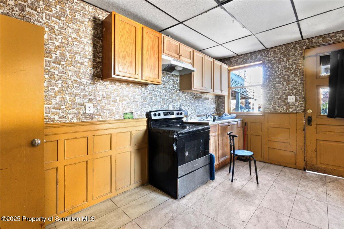 705 Landis Street Scranton, PA 18504 - Photo 31 of 35 a kitchen with a cabinets and appliances