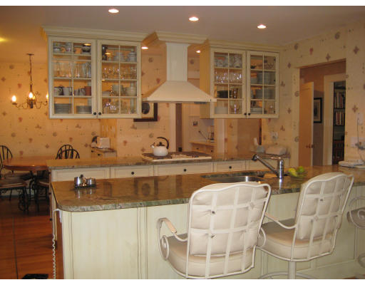 33 Manor House Road Newton, MA 02459 - Photo 7 of 27 a kitchen with a sink and cabinets