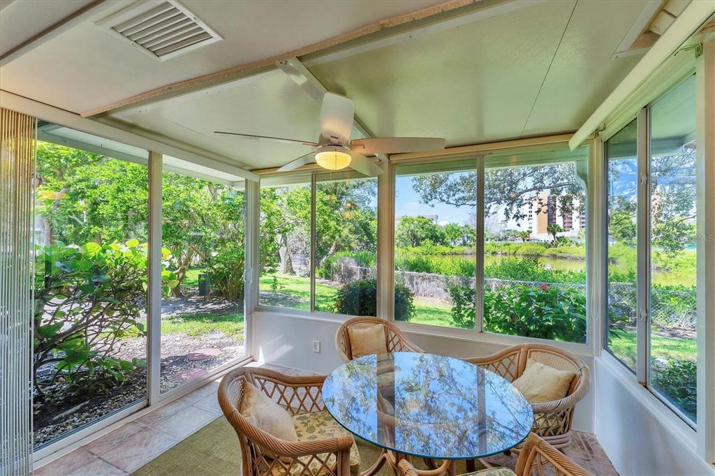 534 Sutton Place Longboat Key, FL 34228 - Photo 12 of 47 a view of a dining room with furniture window and outside view