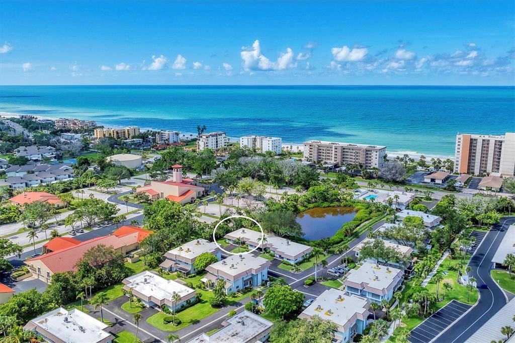 534 Sutton Place Longboat Key, FL 34228 - Photo 22 of 47 a view of a chairs and table in a patio