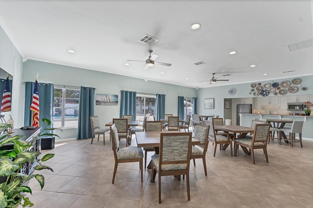 534 Sutton Place Longboat Key, FL 34228 - Photo 45 of 47 a view of a dining room with furniture
