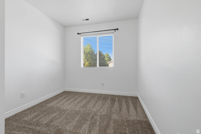 977 East 100 South Payson, UT 84651 - Photo 14 of 19 Empty room featuring carpet floors and baseboards