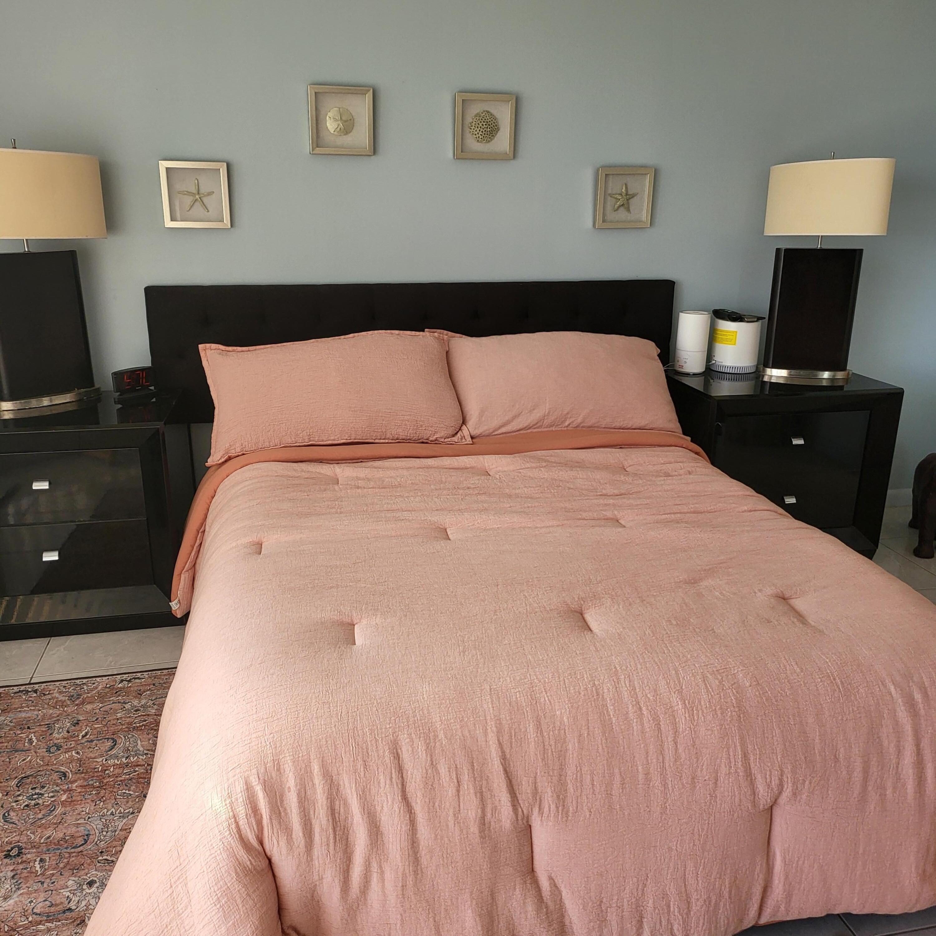 3870 North Hwy A1A, Unit 1011 Hutchinson Island, FL 34949 - Photo 13 of 30 a large bed with a black white comforter