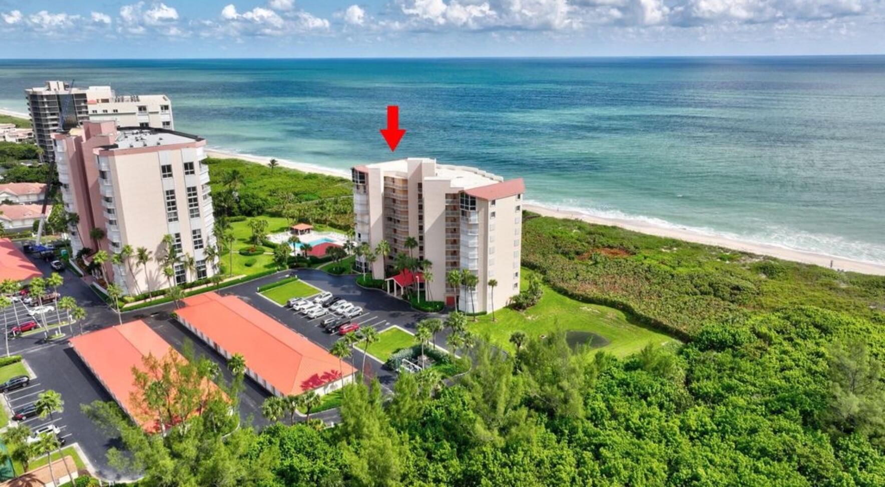 3870 North Hwy A1A, Unit 1011 Hutchinson Island, FL 34949 - Photo 21 of 30 a front view of a house with a yard