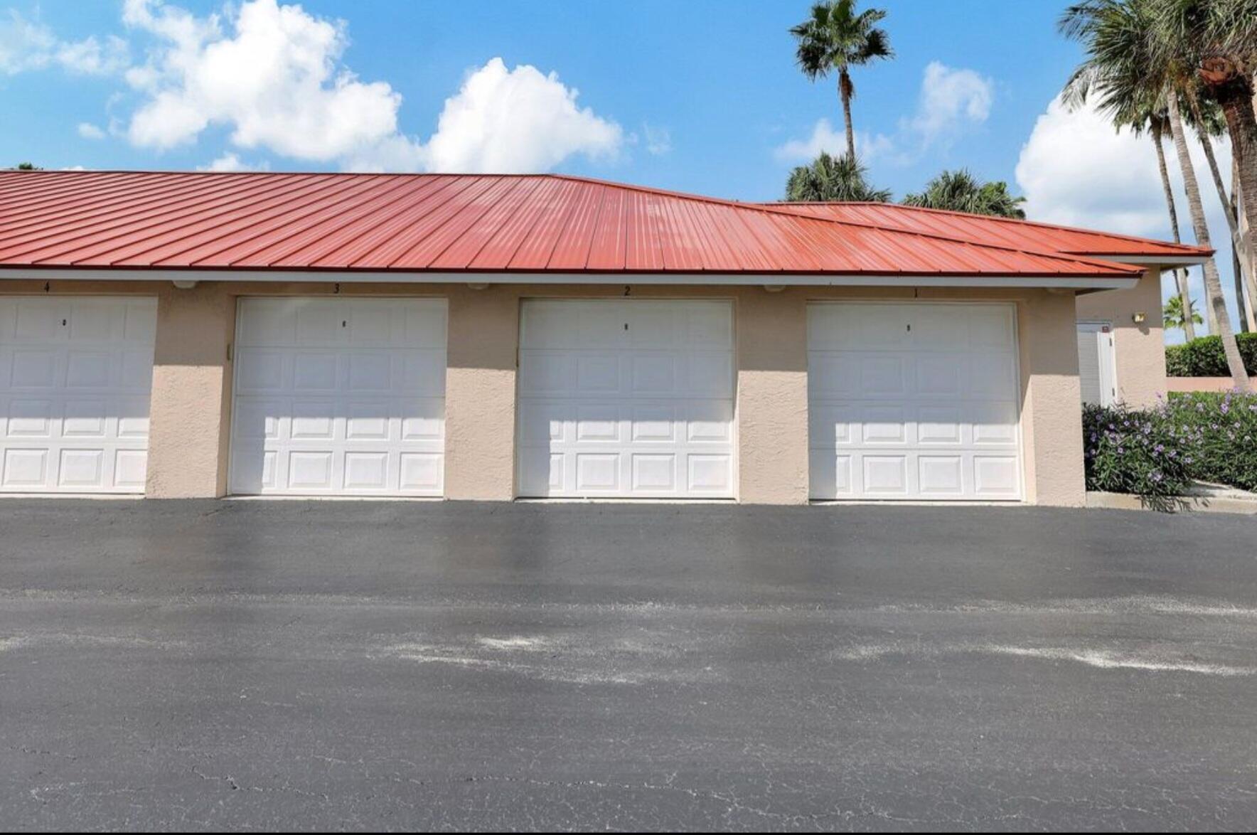 3870 North Hwy A1A, Unit 1011 Hutchinson Island, FL 34949 - Photo 26 of 30 a front view of a house with a garage