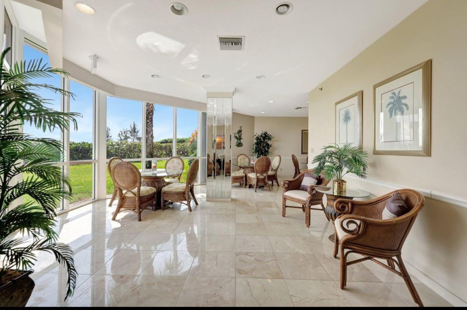 3870 North Hwy A1A, Unit 1011 Hutchinson Island, FL 34949 - Photo 29 of 30 a living room with furniture and a large window