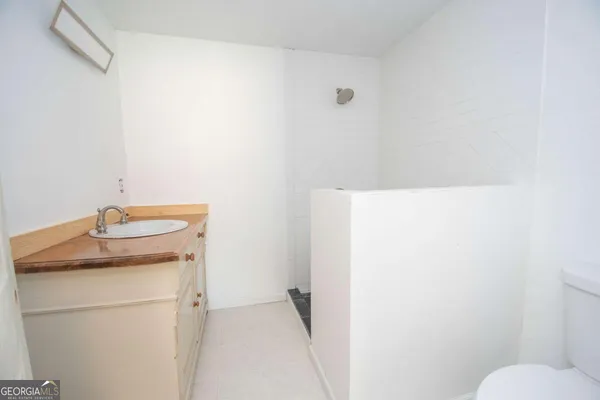 a bathroom with a sink toilet and vanity