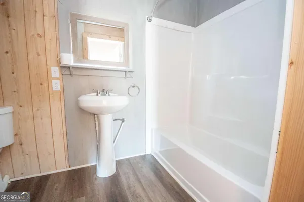 a bathroom with a sink and a bathtub