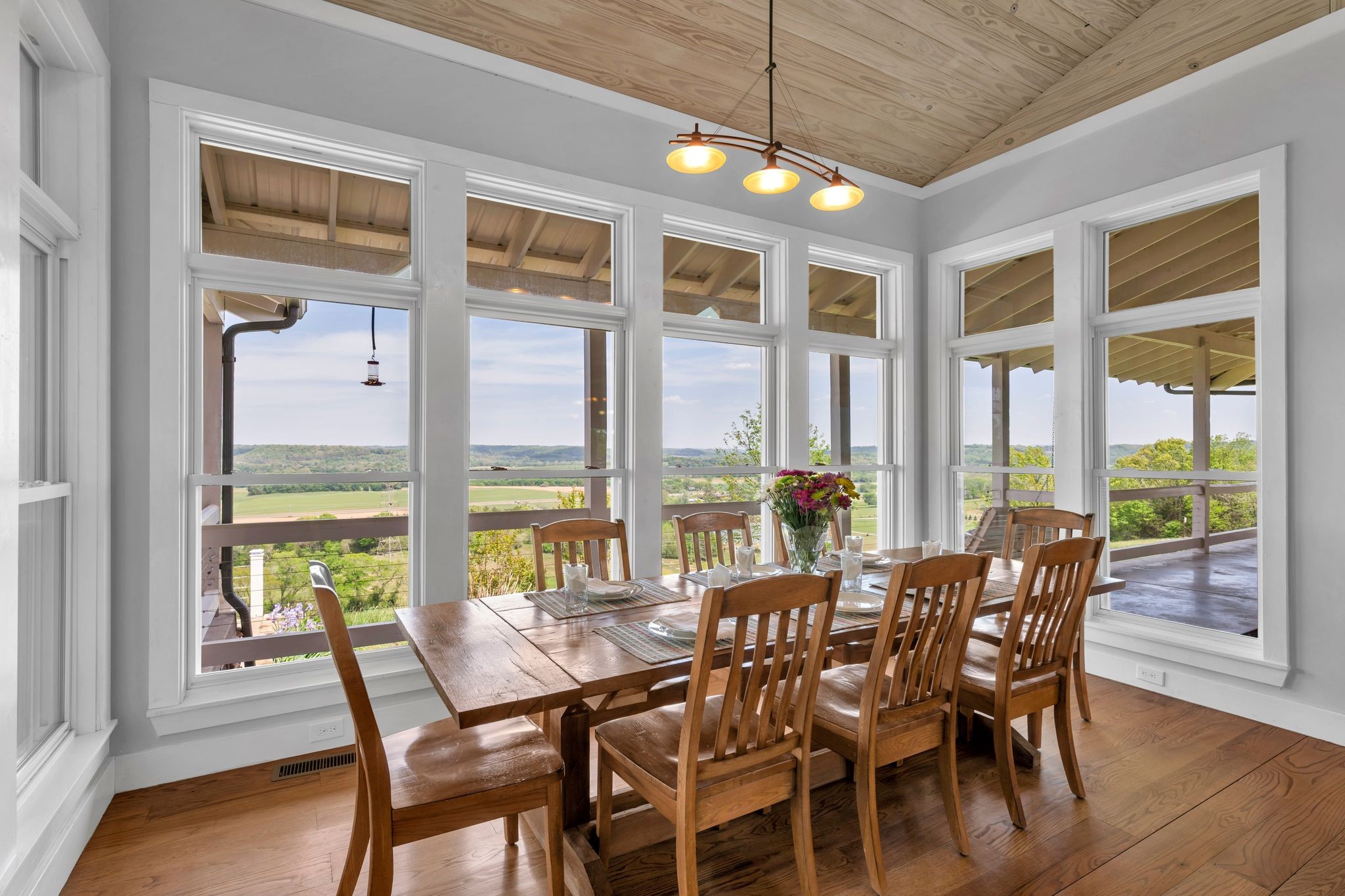39 Fayetteville Road Kelso, TN 37348 - Photo 19 of 75 a view of a dining room with furniture large windows and wooden floor