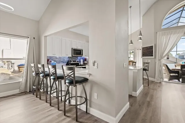 a view of a dining room with furniture window and wooden floor