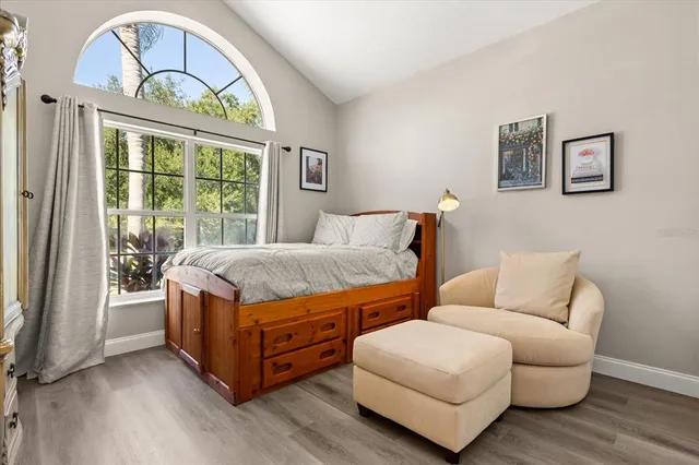 a living room with a large bed and a large window