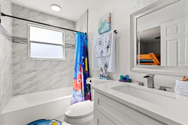 a bathroom with a sink a toilet and a bathtub