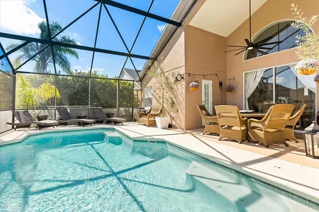 a view of a swimming pool with a patio