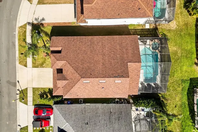 an aerial view of residential houses with outdoor space