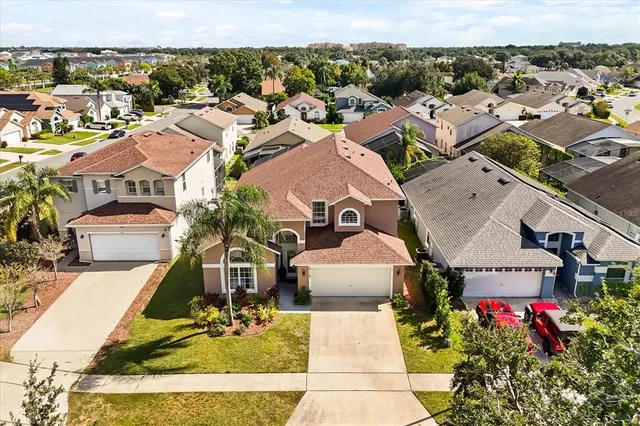 an aerial view of residential houses with outdoor space