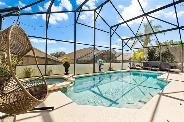a view of a swimming pool with a lounge chair