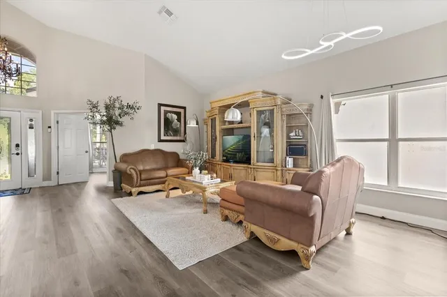 a living room with furniture and a window