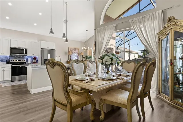 a view of a dining room with furniture window and wooden floor