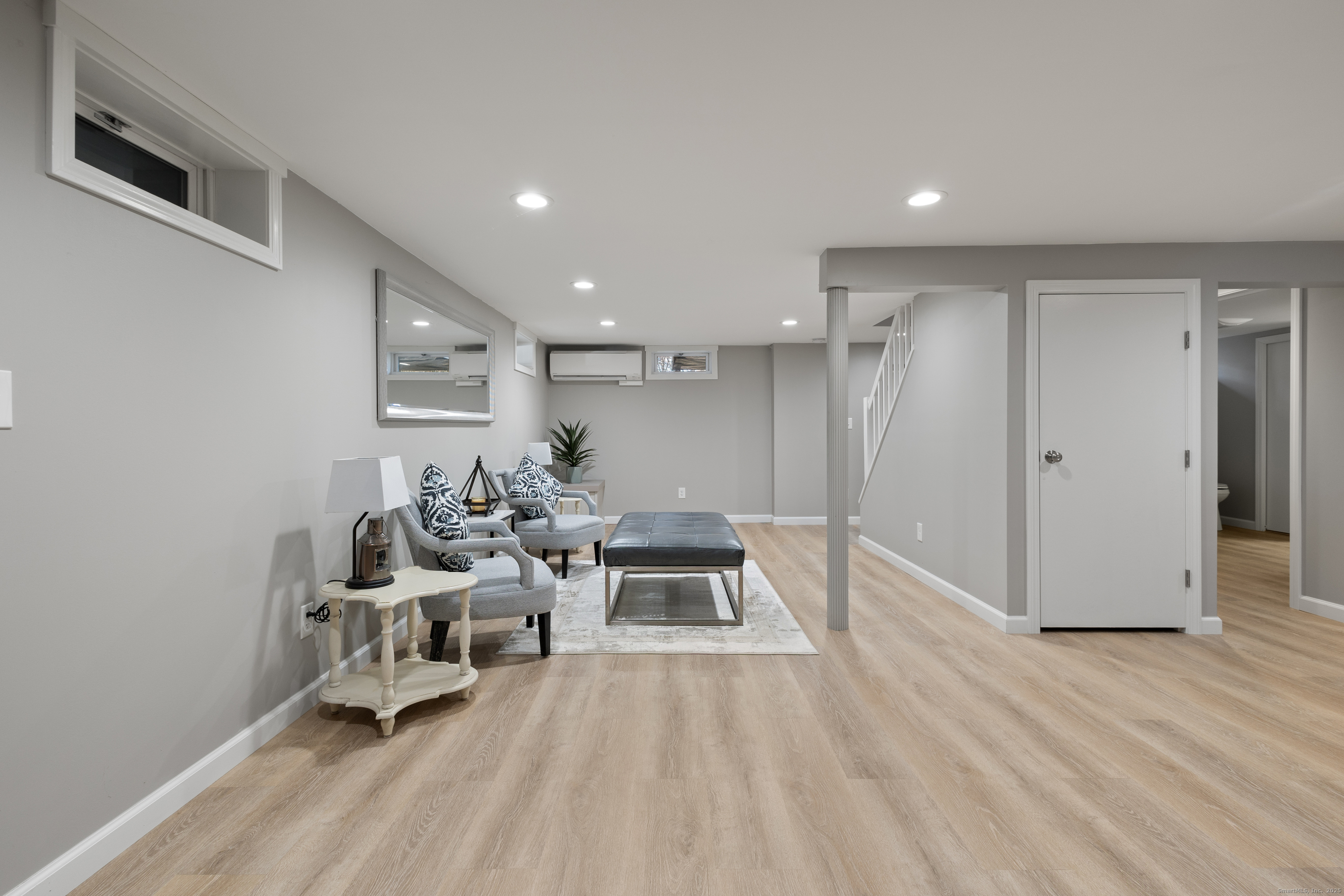 60 Indian Spring Road Woodstock, CT 06282 - Photo 20 of 32 a living room with furniture and a wooden floor