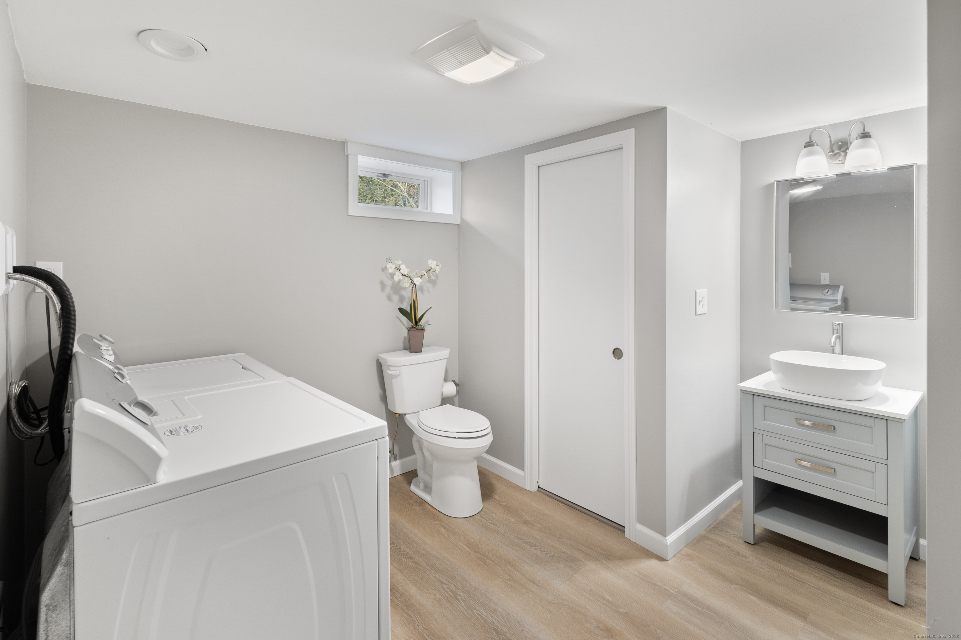60 Indian Spring Road Woodstock, CT 06282 - Photo 22 of 32 a bathroom with a toilet sink and a mirror
