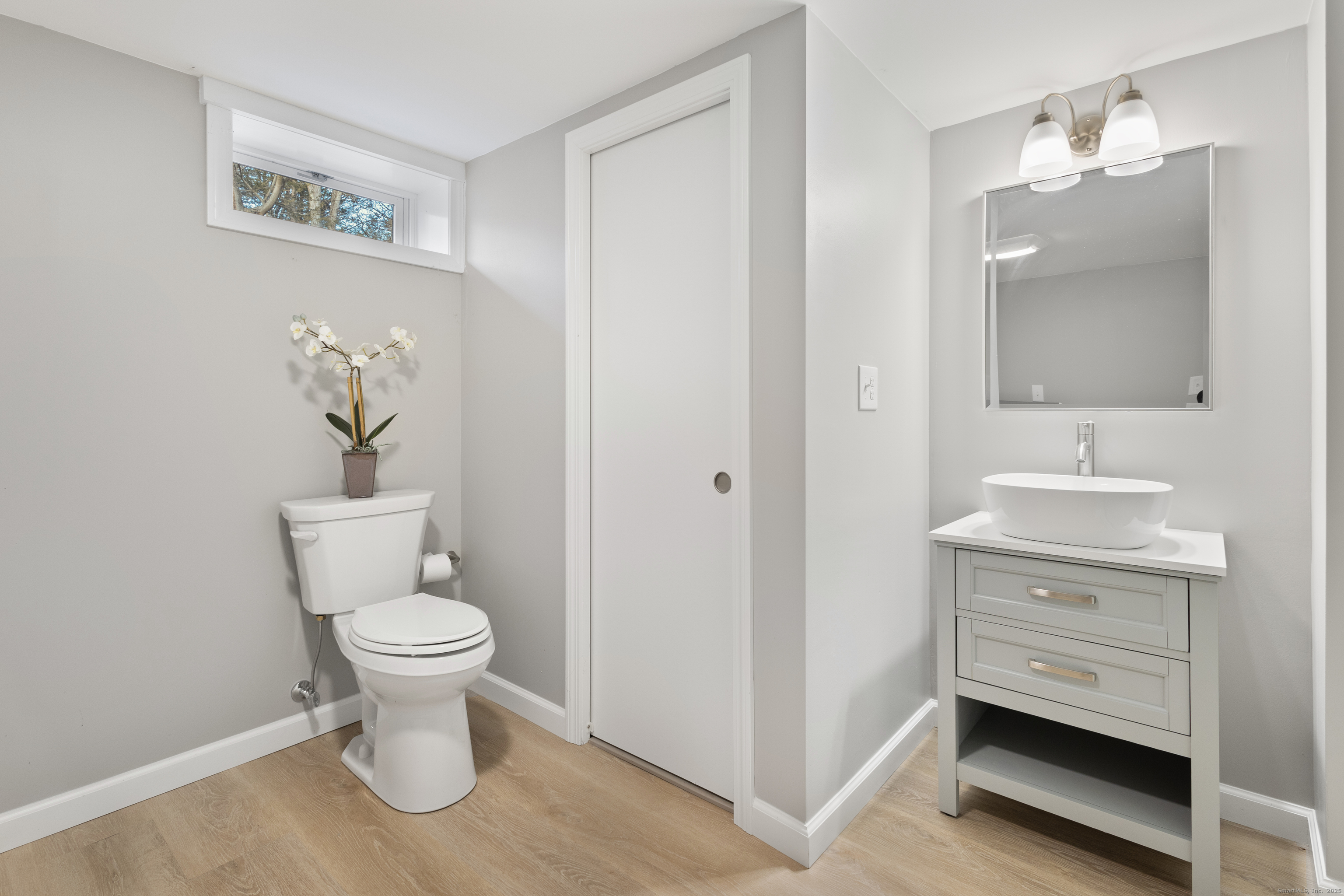 60 Indian Spring Road Woodstock, CT 06282 - Photo 23 of 32 a bathroom with a toilet sink and mirror