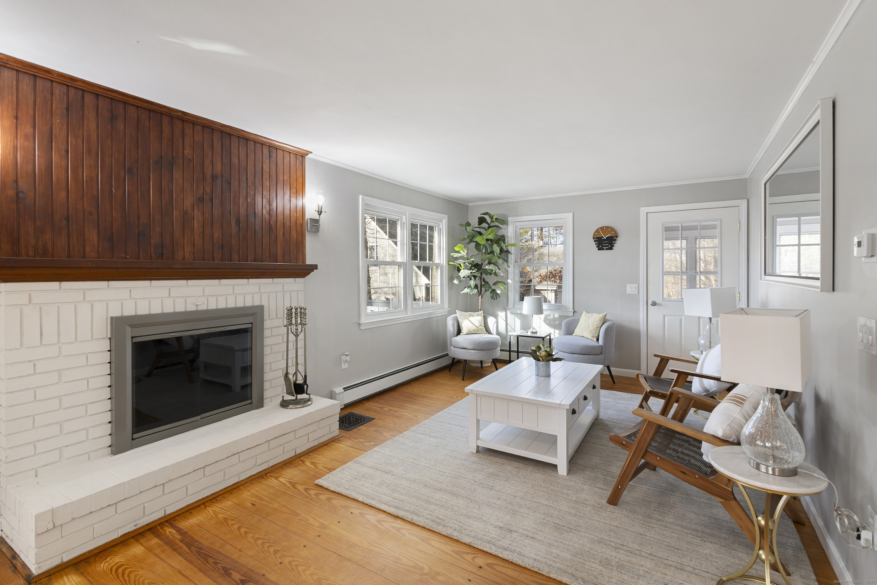 60 Indian Spring Road Woodstock, CT 06282 - Photo 7 of 32 a living room with furniture and a fireplace