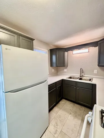 a view of a house with a snow in the yard
