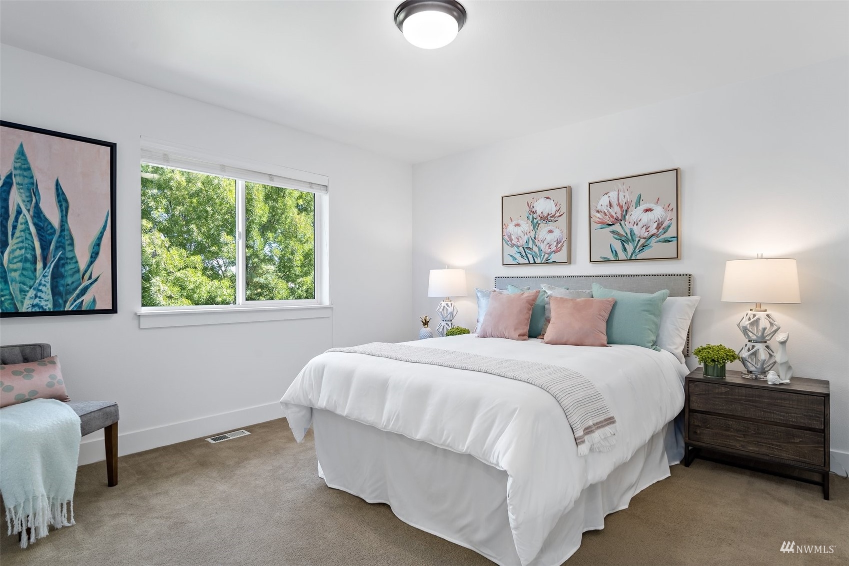 1012 North 29th Street Renton, WA 98056 - Photo 27 of 40 a bedroom with a bed and a painting on the wall