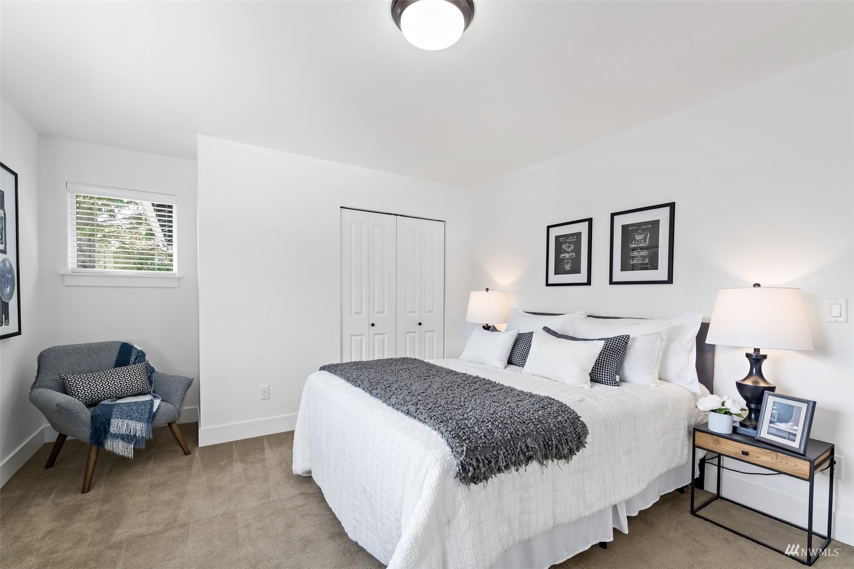 1012 North 29th Street Renton, WA 98056 - Photo 30 of 40 a bedroom with a bed and chair