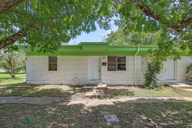 front view of a house with a yard