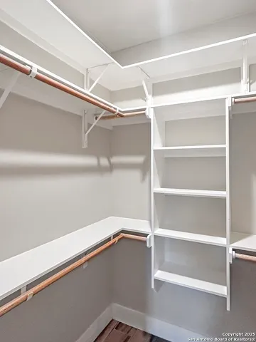 a view of an empty walk in closet