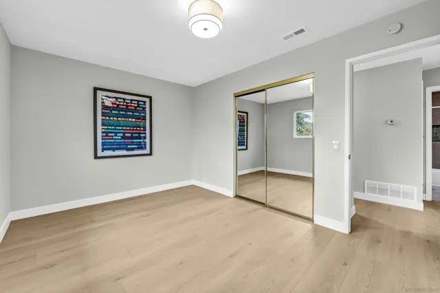a view of an empty room with glass door