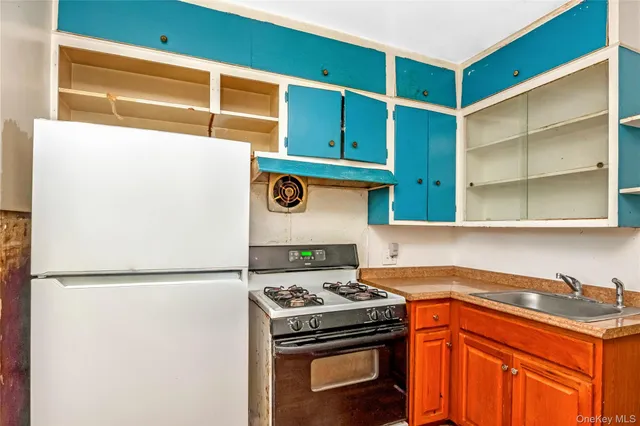 a kitchen with a stove and a refrigerator