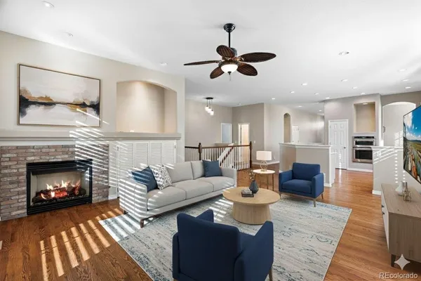 a living room with furniture and a fireplace