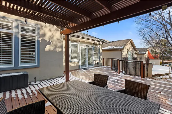 a view of balcony with furniture and wooden roof